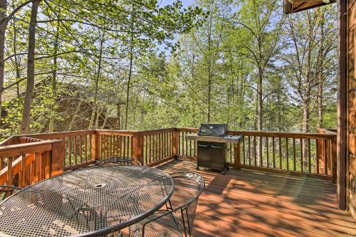 a patio with a table and chairs on a deck at Lakefront South Carolina Abode with Deck and Boat Dock in Fair Play