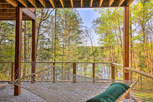 a hammock in a tree house with a view at Lakefront South Carolina Abode with Deck and Boat Dock in Fair Play