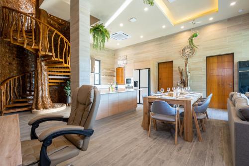 a dining room and kitchen with a table and chairs at Three Monkeys Villas in Patong Beach