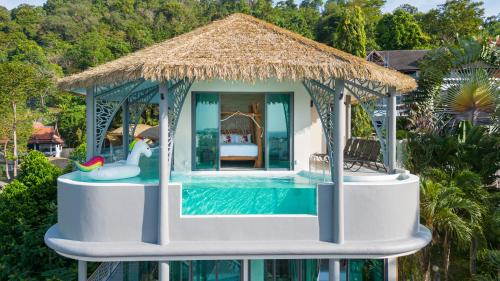 a pool house with a gazebo at Three Monkeys Villas in Patong Beach