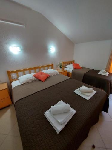 Un ou plusieurs lits dans un hébergement de l'établissement Guest House As