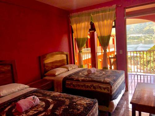 Tempat tidur dalam kamar di Hotel Adulam