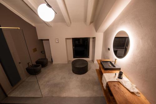 a large room with a sink and a mirror at Relais Chiarene in Novello