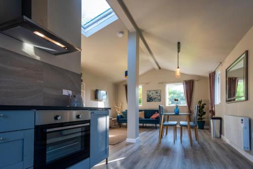 a kitchen and living room in a house at The Rose Suite Kenmare in Kenmare