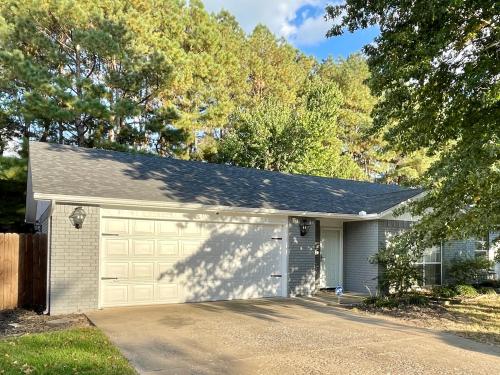 a house with a garage with a driveway at Do not book this property I am trying to remove it and am unable in Fayetteville
