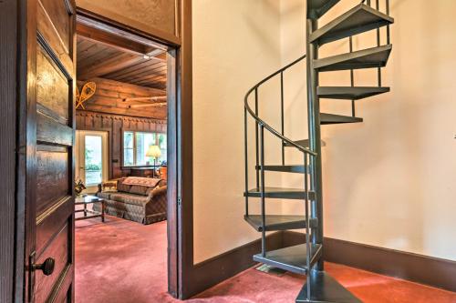 a spiral staircase in a room with a living room at Riverfront Wilcox Home on the East Branch! in Wilcox