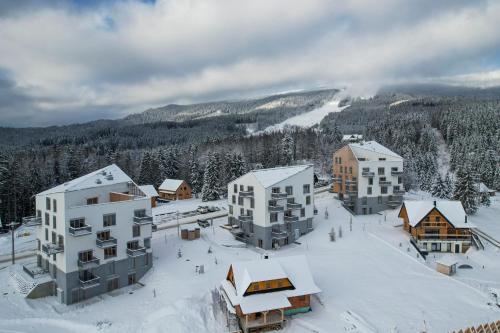 an aerial view of a resort in the snow at Hillside Kubínska Hoľa - Apartmán Bird's eye view in Dolný Kubín