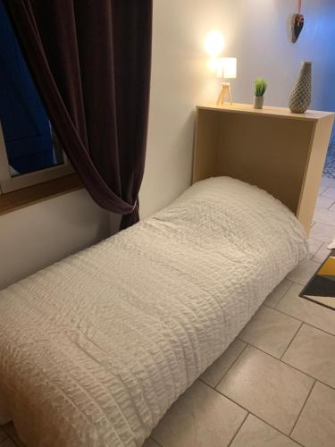 Posteľ alebo postele v izbe v ubytovaní la maison bleue appart 1