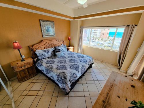 A bed or beds in a room at Las Palmas Resort Condo 603 with amazing sea view