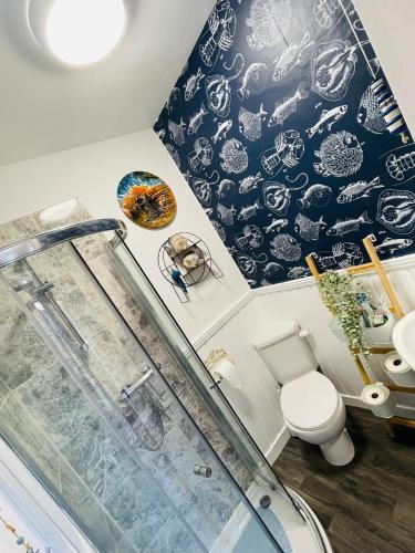 a bathroom with a shower and a toilet at Life’s a Beach, MONTROSE SCOTLAND in Montrose