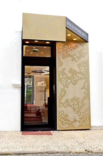 a door to a store with a sign on it at Lisbon City Hollywood Hotel by City Hotels in Lisbon