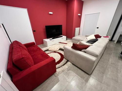 a living room with two couches and a television at Il Canneto in Lomnago