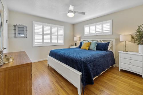 a bedroom with a bed and two windows at Hillcrest Haven in Morro Bay