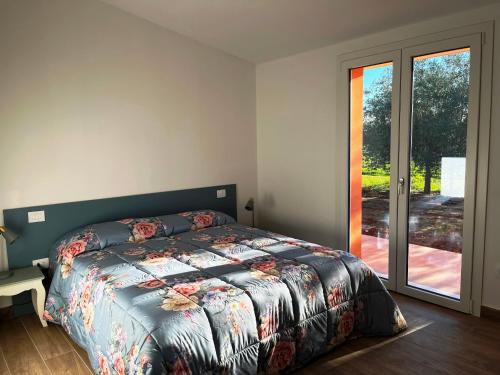 Ένα ή περισσότερα κρεβάτια σε δωμάτιο στο Agriturismo La Quercia dei Tigli