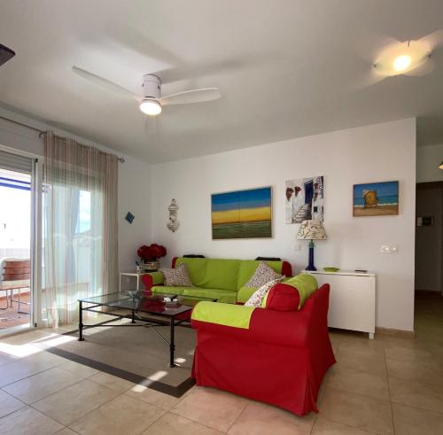 a living room with a couch and a table at RESIDENCIAL OASIS 2 in Mojácar