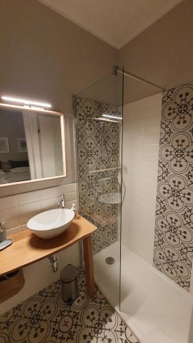 a bathroom with a sink and a shower at Contrada d'Amore in Angera