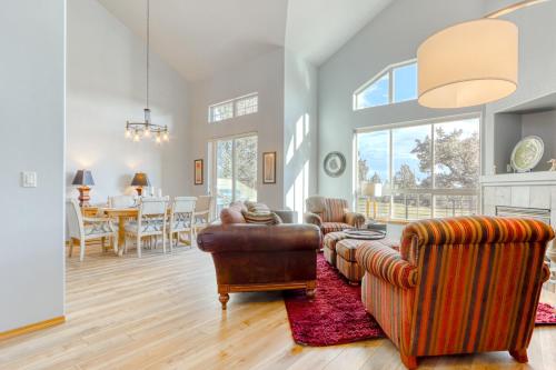 a living room with a couch and chairs and a table at Cinnamon Teal Dream in Redmond