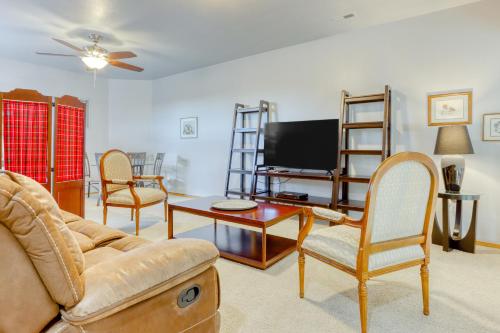a living room with a couch and a tv at Cinnamon Teal Dream in Redmond