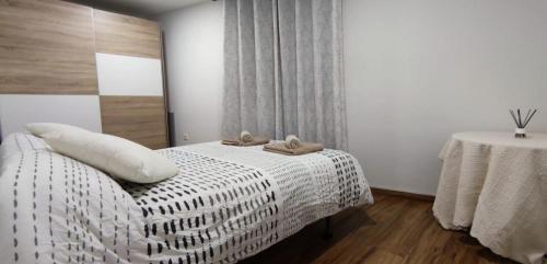 A bed or beds in a room at Acogedor Ático en Pleno Centro