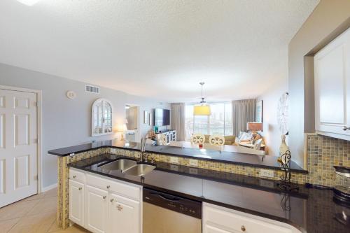 a kitchen with a sink and a counter at The Terrace at Pelican Beach 504 in Destin