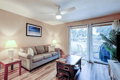 a living room with a couch and a table at Hilton Head Cabanas 14 in Hilton Head Island