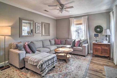 a living room with a couch and a table at Fire Pit and Yard Charming Port Royal Home! in Port Royal