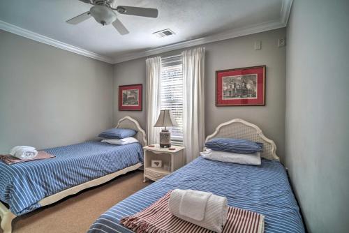 a bedroom with two beds and a ceiling fan at Fire Pit and Yard Charming Port Royal Home! in Port Royal