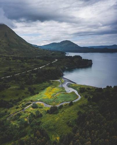 an aerial view of a riverurrency with a road at THE SHORELINE CABIN in Kodiak