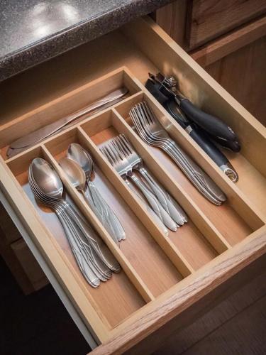 a drawer with silver utensils in a kitchen at The Lofts at Myrtle in El Paso