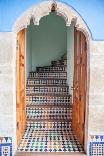 an entrance to a stairway with a patterned floor at Dar Shaeir in Rabat