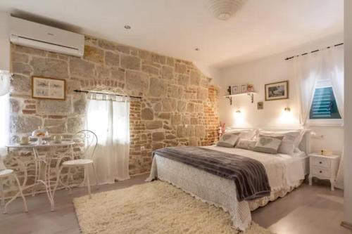 Posteľ alebo postele v izbe v ubytovaní Rusticus domus studio