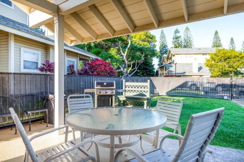 a patio with a table and chairs and a fence at Hau'Oli at Waikoloa Hills #902 in Waikoloa Village