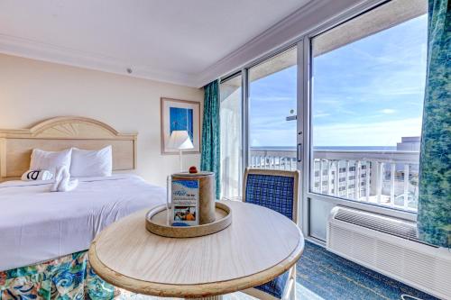 a hotel room with a bed and a large window at Daytona Beach Resort 803 in Daytona Beach