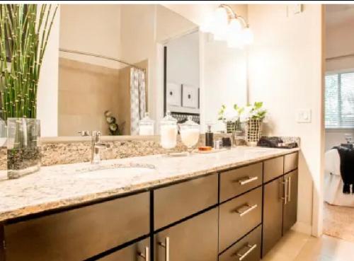 a bathroom with a sink and a large mirror at A-Class Luxury 2 Bedrooms Apt in Woodland Hills CA in Los Angeles