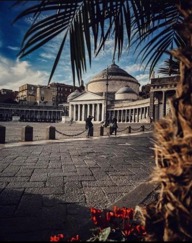 a large building with a dome on top of it at Apartment NAPOLI MARADONA in Naples