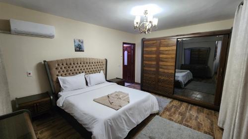 A bed or beds in a room at Alex sea view apartment - families only