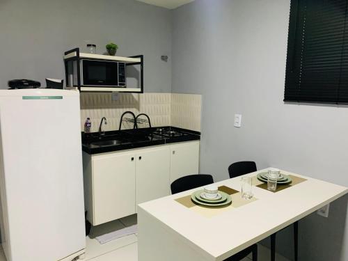 Una cocina o cocineta en Edifício Creta Hotel