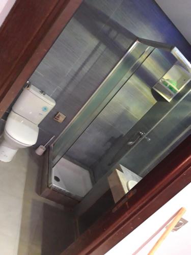 a bathroom with a toilet on a train at Islane in Agadir