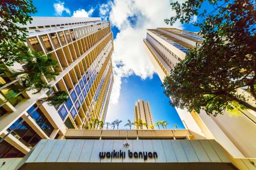 a tall building with the words wroth bengnard at Waikiki Banyan Fabulous Ocean View Condo with Free Parking in Honolulu