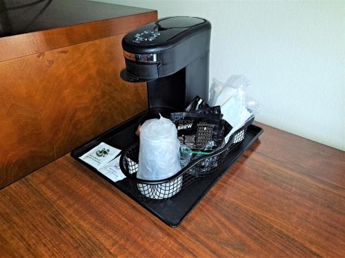 a coffee maker on a tray on a table at Suites Catonsville MD Baltimore West in Catonsville