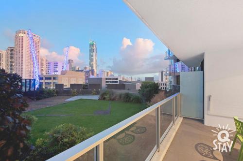 a balcony with a view of a city skyline at KIDS STAY FREE in Hinterland View 1 Bedroom SPA Apartment at Circle on Cavill - Q STAY in Gold Coast
