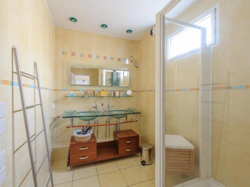 a bathroom with a shower and a sink and a mirror at Duplex 4 pièces, balcon, 6 pers, Châtelaillon-Plage, Wi-Fi - FR-1-535-38 in Châtelaillon-Plage