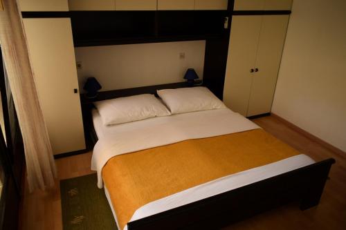 a bedroom with a large bed in a room at Rooms in Vodice with balcony, air conditioning, WiFi 4826-1 in Vodice