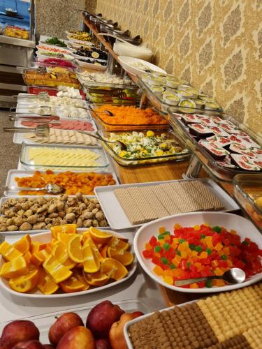 a buffet filled with lots of different types of food at Hamit Hotel Istanbul in Istanbul