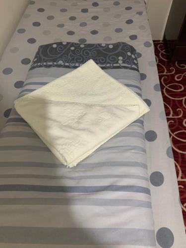 a bed with a pillow on top of it at Ankara apart Hostel 1 in Altındağ