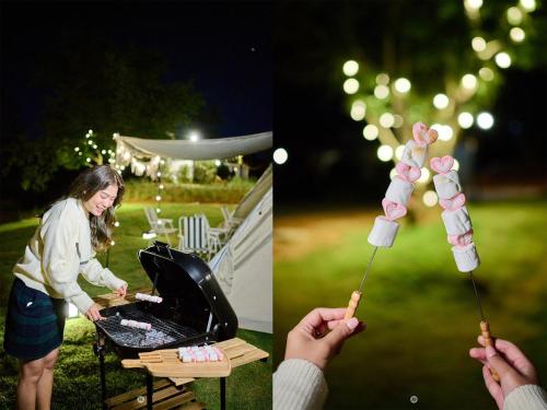 a woman holding a bunch of marshmallows on a stick over a grill at SOL Glamping at Khao yai in Ban Nong Makha