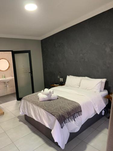 Ένα ή περισσότερα κρεβάτια σε δωμάτιο στο Bo Kamer Guesthouse