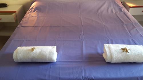Postel nebo postele na pokoji v ubytování Hotel Serenella