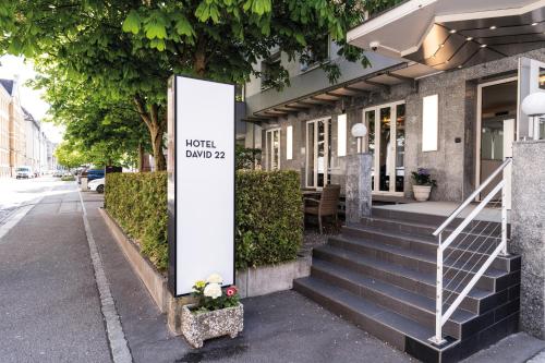 a sign on the side of a building at Self Check-In Hotel David 22 in St. Gallen