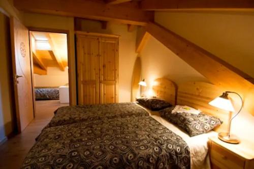 Ein Bett oder Betten in einem Zimmer der Unterkunft B&B Benvenuti - Dolomiti di Brenta